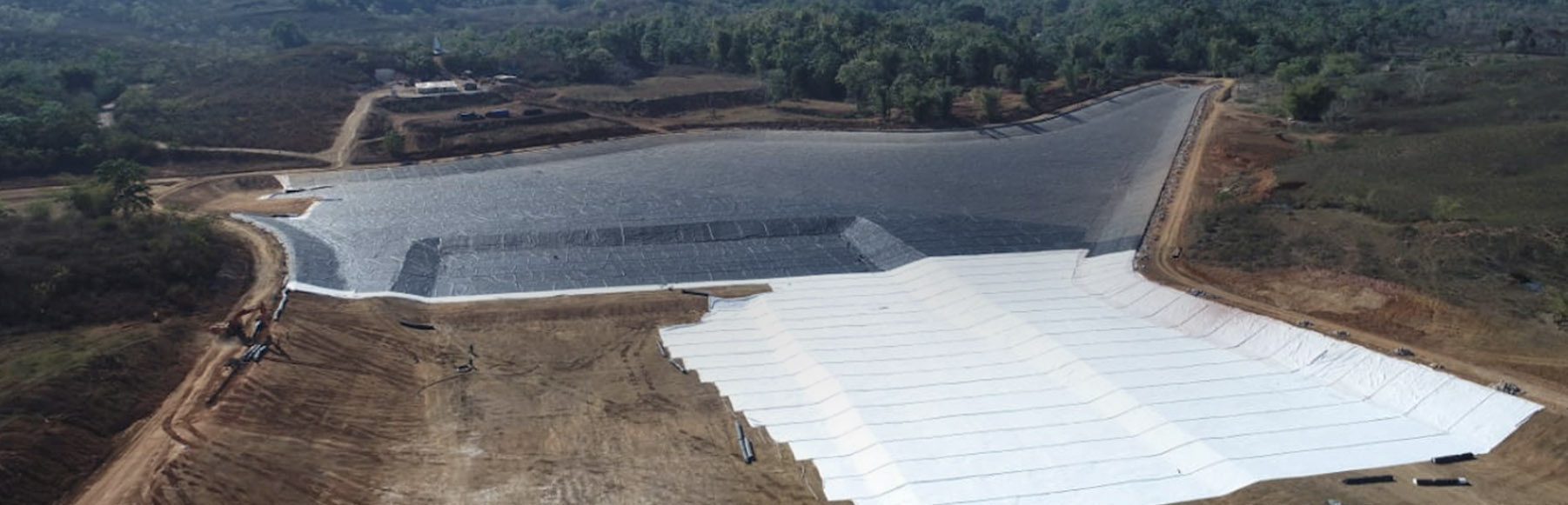 Large scale installation of geotextile lining in an excavated reservoir